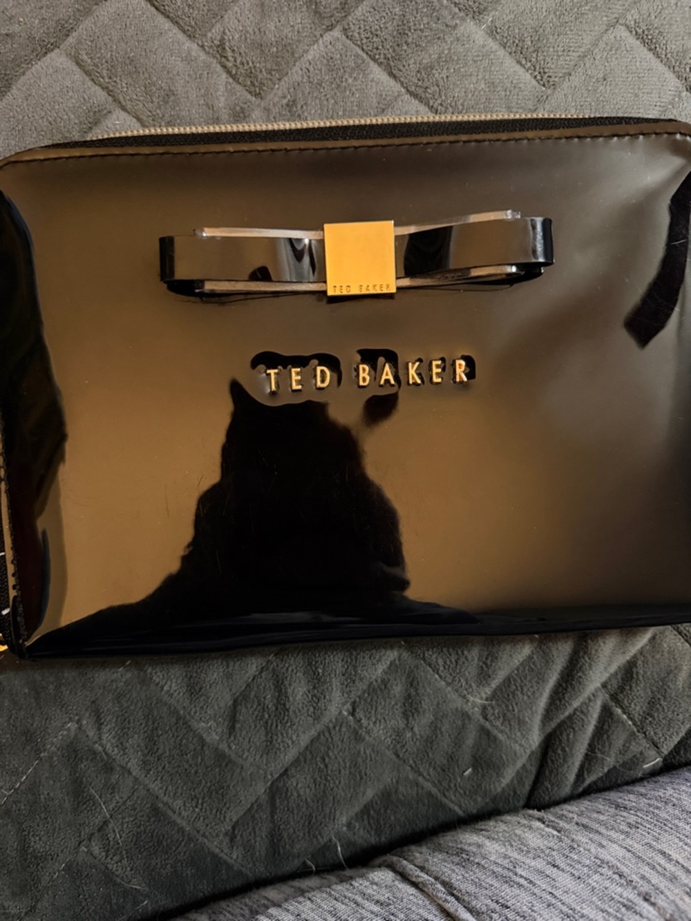 Ted Baker Black Patent Bow Cosmetic Case with Gold Accent